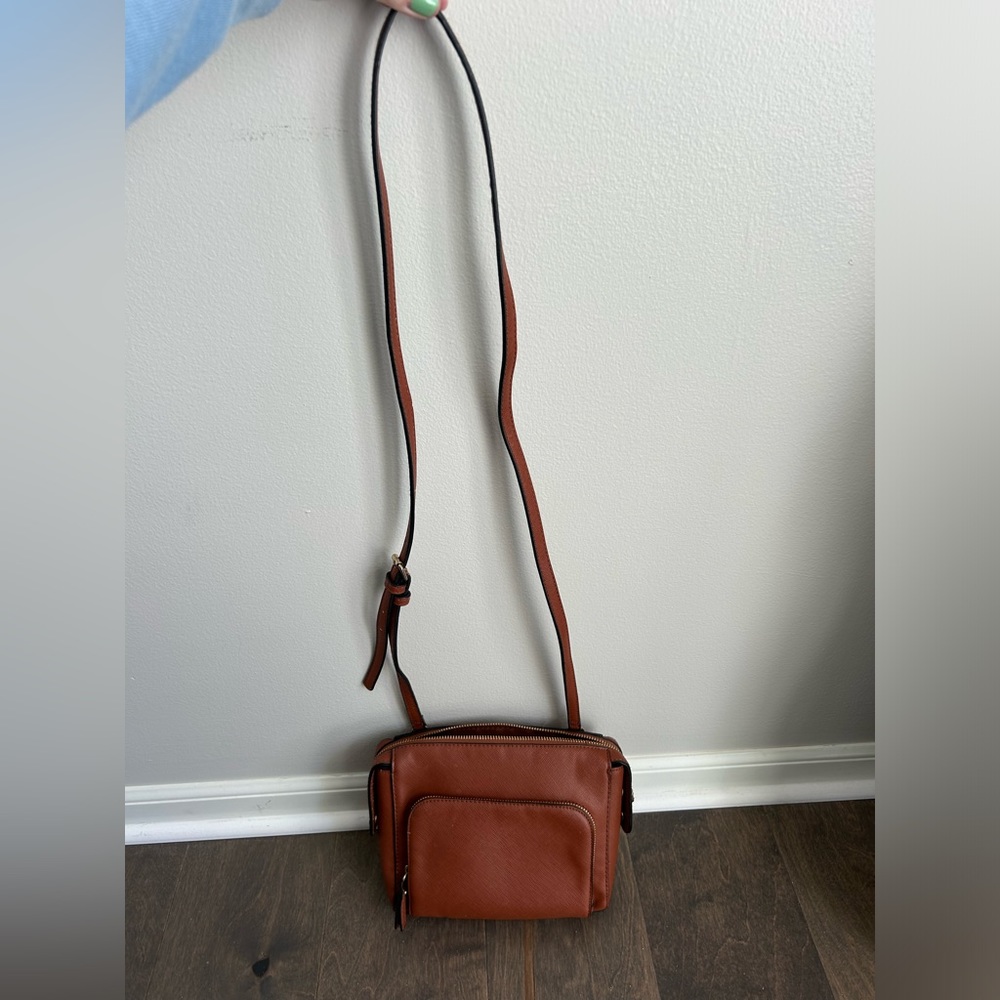 Small brown crossbody clutch bag